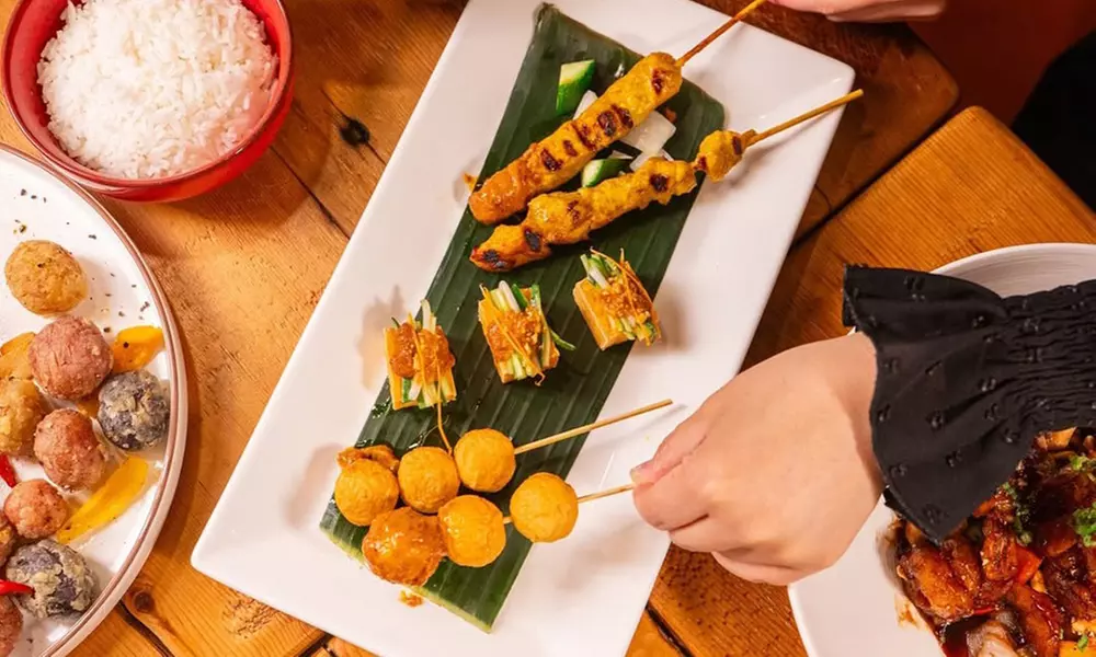 Savor $50 Dining Credit or Dinner with Cocktails for Two or Four