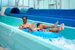 Experience Thrilling Waterslides & Year-Round Tropical Fun w/ Admission for One at Island Waterpark in Atlantic City - Second Medium