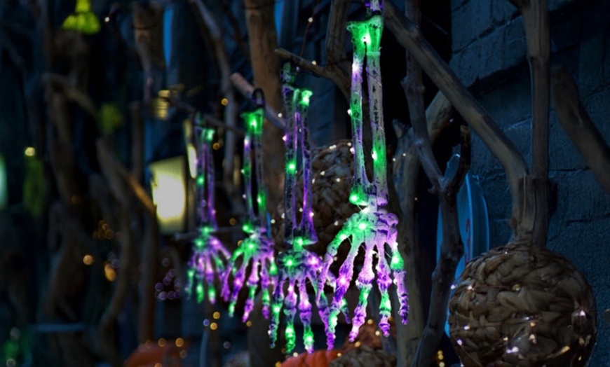 Image 6: Five-Pack Halloween Solar Skull Hand Ground Lights