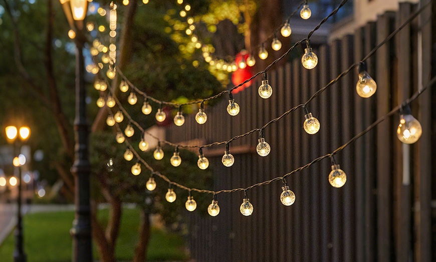 Image 6: Solar-Powered Ball String Lights
