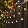 Image 6: Solar-Powered Ball String Lights
