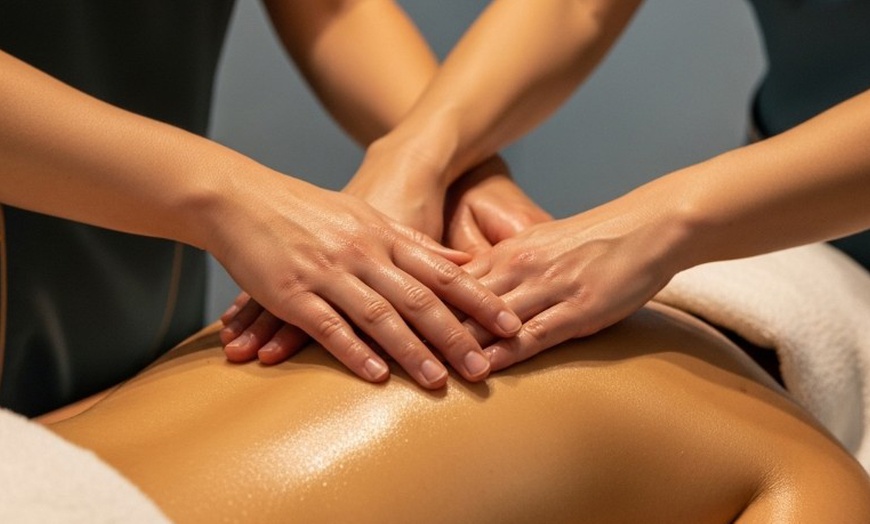 Image 1: 60- or 90-Minute Sessions of Four Hands Deep-Tissue or Swedish Massage 