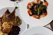 Unwind and Indulge: $25 or $55 Towards Food and Drink or Two Entrees and a Bottle of Wine ( Up to 31% Off ) - Second Medium
