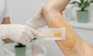 Complete Body Glow: Full Arm, Full Leg, Underarm, or Full Body Waxing w/ Threading (Up to 65% Off)