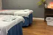 60 or 90-Min Signature Couples Massage with Hot Stones, Hot Pillow, Deep Tissue, and Essential Oil Up to 31% Off - Second Medium