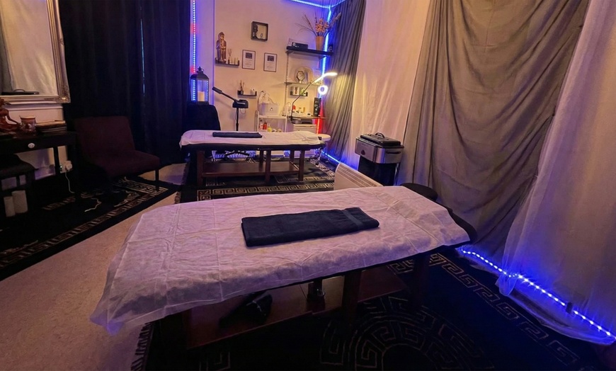 Image 3: Unwind with 60- or 90-Minutes Hot Stone or Deep Tissue Massages