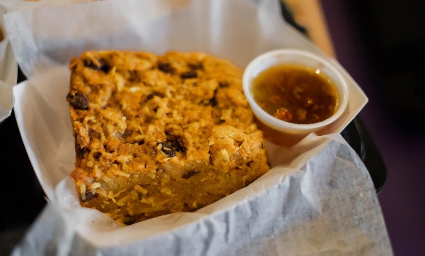 Image 5: Two Po'Boys, Meals for Two or Four With Beignets, and $50–$75 Credits