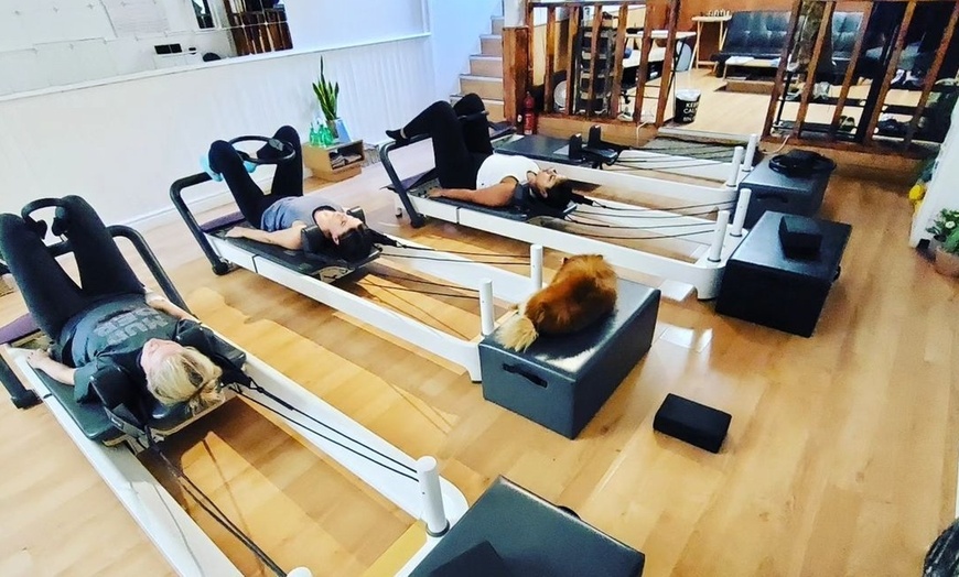 Image 2: Elevate Your Wellness Journey: 5, 10, or 20 Reformer Pilates Classes at Flowing Body Pilates (Up to 63% Off)