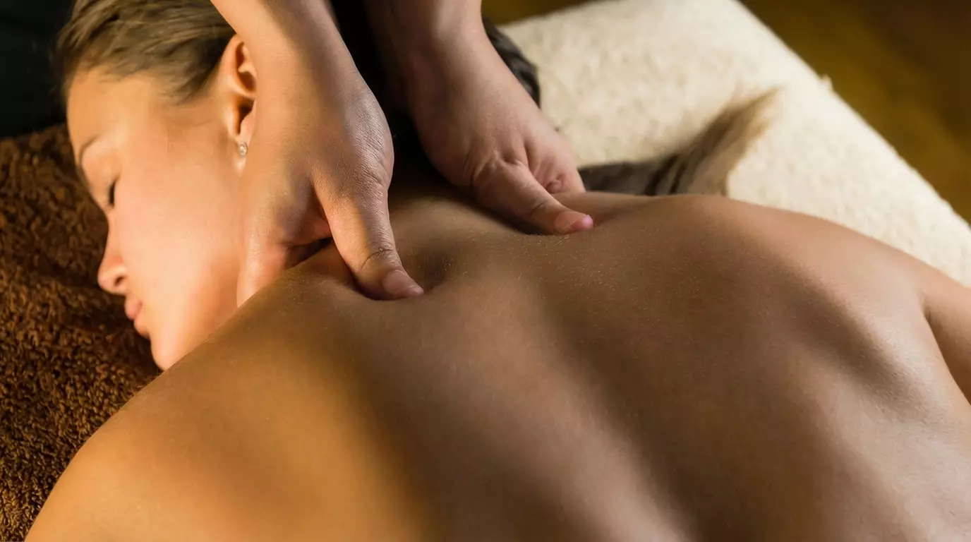 Unwind with 60-Min Hot Stone or Deep Tissue Massage w/ Optional 15-Min Foot Scrub(Up to 32% Off) - Primary Image