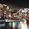 Image 1: Amsterdam Light Festival vanaf het water in een elektrische salonboot