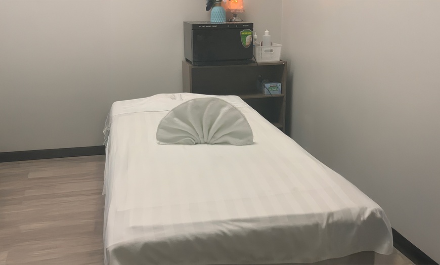 Image 1: 60-Minute Massage with Hot Stones or 90-Minute Pampering Package