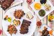 $30 or $60 to Spend on BBQ Cuisine or Choose a BBQ Packages at Munchies Live BBQ (Up to 35% Off) - Second Medium