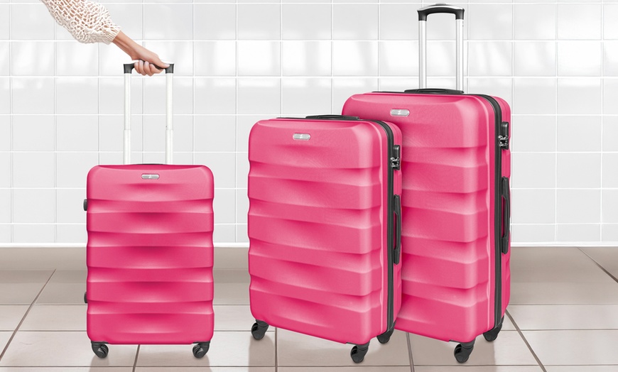 Image 7: Set da 3 valigie da viaggio in abs