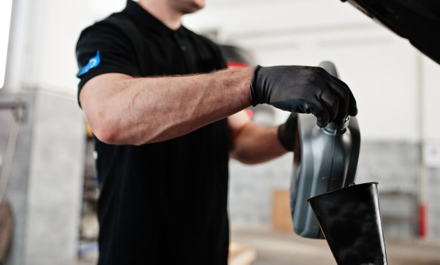 Image 2: Premium Full or Blend Oil Change Service + Free Car Wash