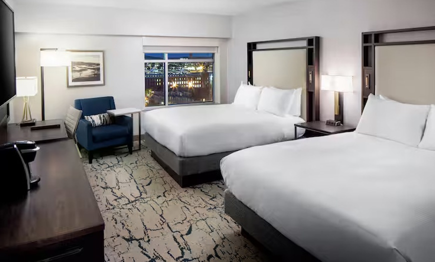 Image 8: Modern 4-Star Stay w/ Pool, Dining, & SNHU Arena Convenience