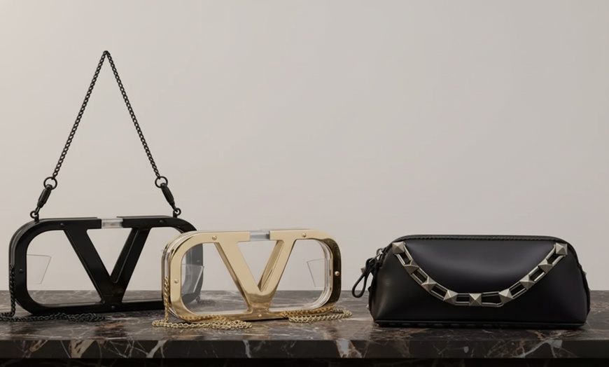 Image 1: Valentino Garavani Rockstud & Logo Clutches | Designer Bags (Up to 53% Off)