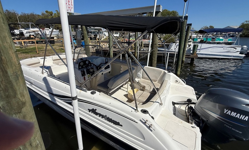 Image 2: Enjoy Relaxation and Fun with a Hurricane Deck Boat Rental! 