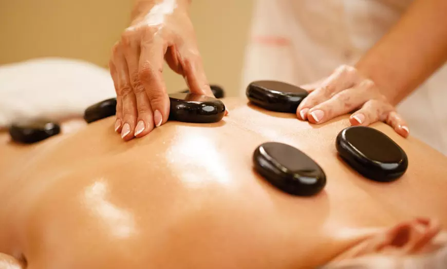 Image 1: 30, 50 or 70-Minute Hot Stone Massage with Warm Organic Oil for 1 or 2
