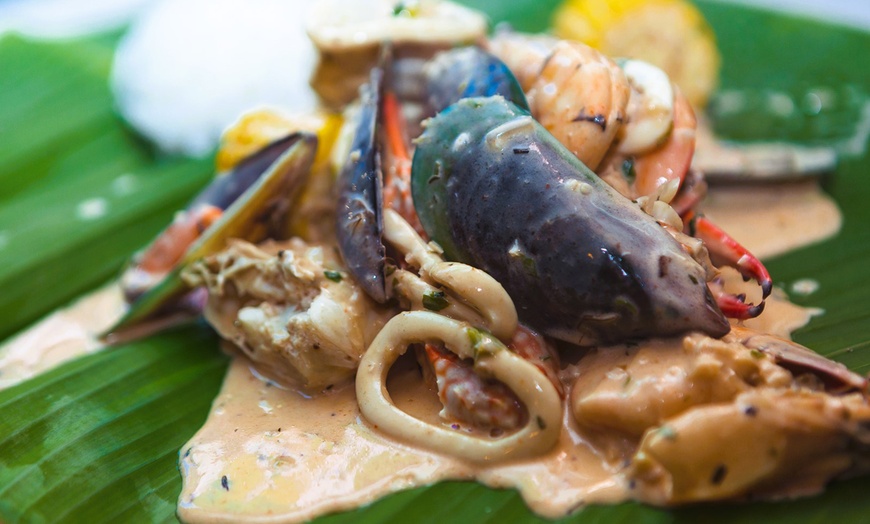 Image 4: Seafood with Rice, and Ice Tea