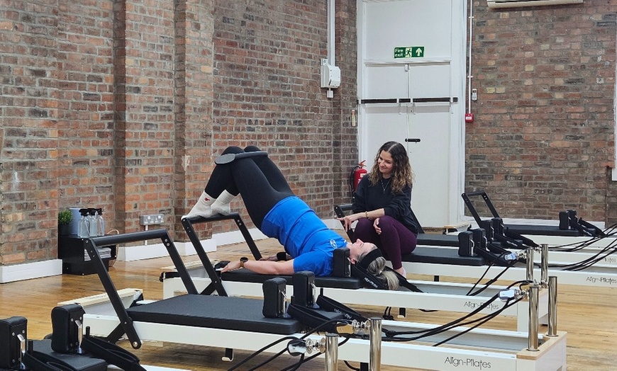 Image 4: Elevate Your Wellness Journey: 5, 10, or 20 Reformer Pilates Classes at Flowing Body Pilates (Up to 63% Off)