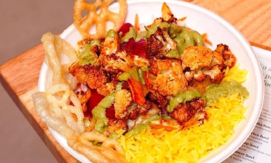 Image 2: Get $50–$150 Toward Food & Drinks at Me & Yogi Indian Kitchen
