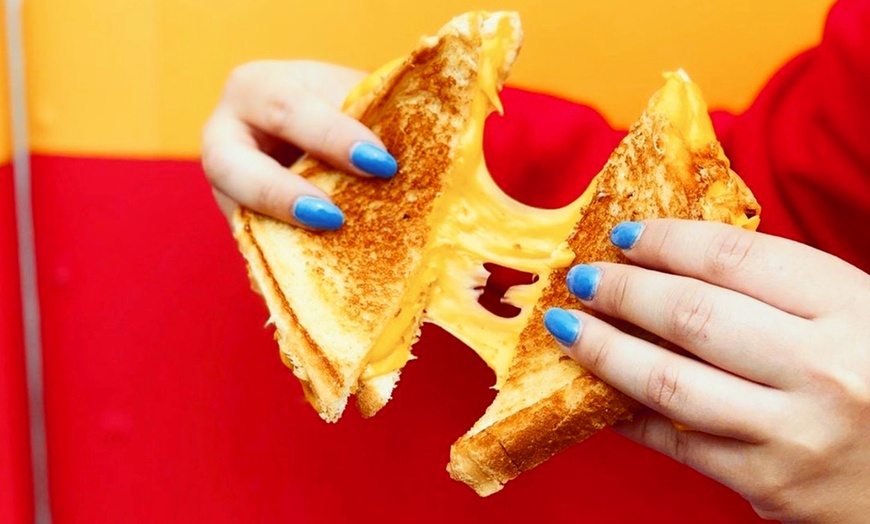 Image 1: Enjoy Two Sandwiches & Two Sides or $10 Voucher| Delicious Deals Await