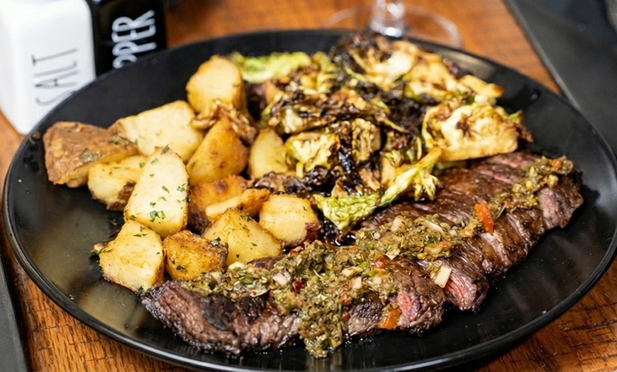 Image 3: Dinner for Two or Four with Cocktails or $50 or $100 Dining Credit