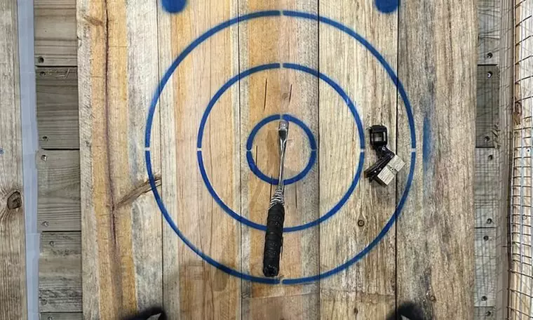Unleash Your Inner Warrior: Axe Throwing – Book Your Rampage Session!