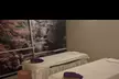 Up to 57% Off: 60-Minute Deluxe Body Massage with Essential Oils & Hot Stones for Couples - Second Medium