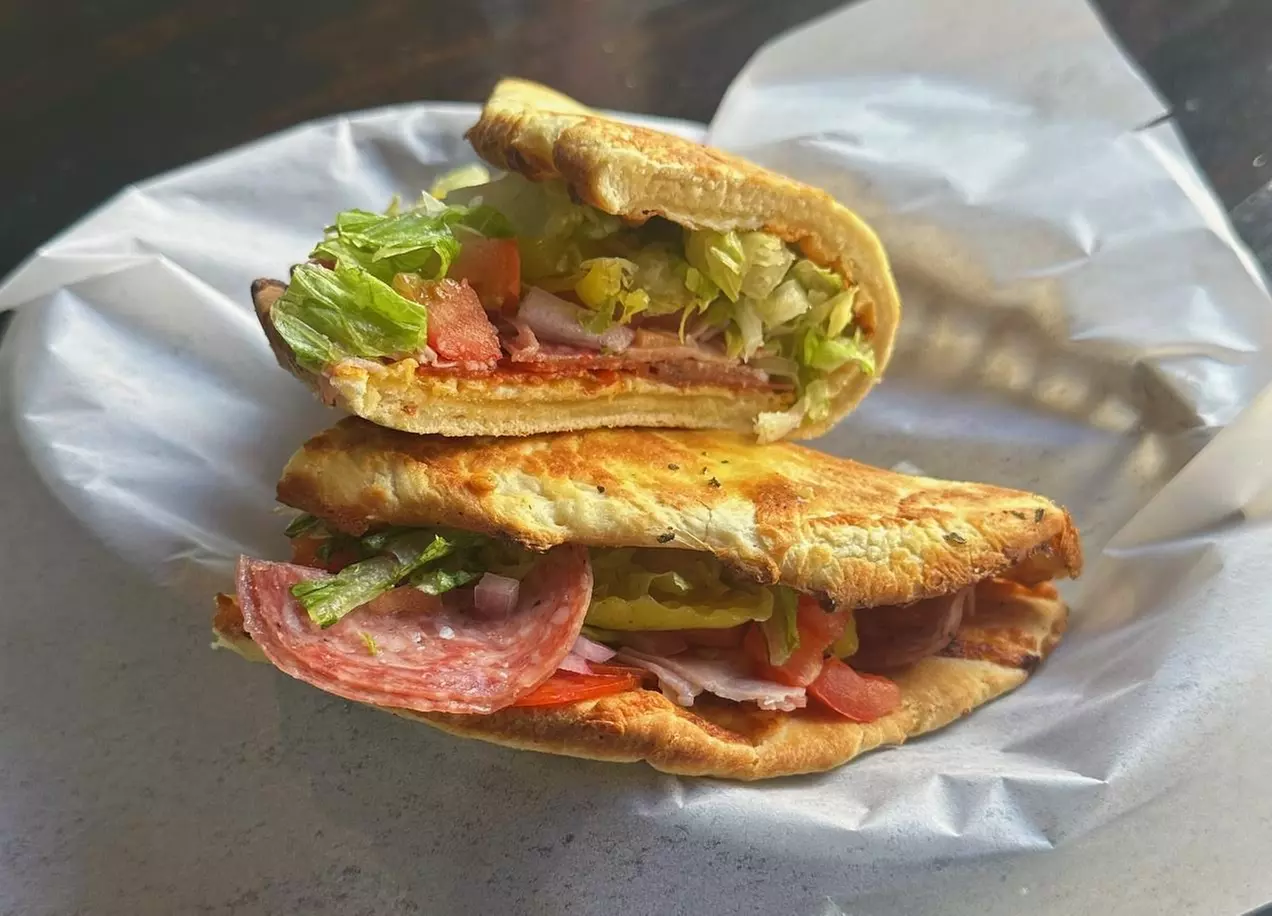 Enjoy Artisan Pizza, Specialty Sandwiches, Salads, Wings & Great Beers