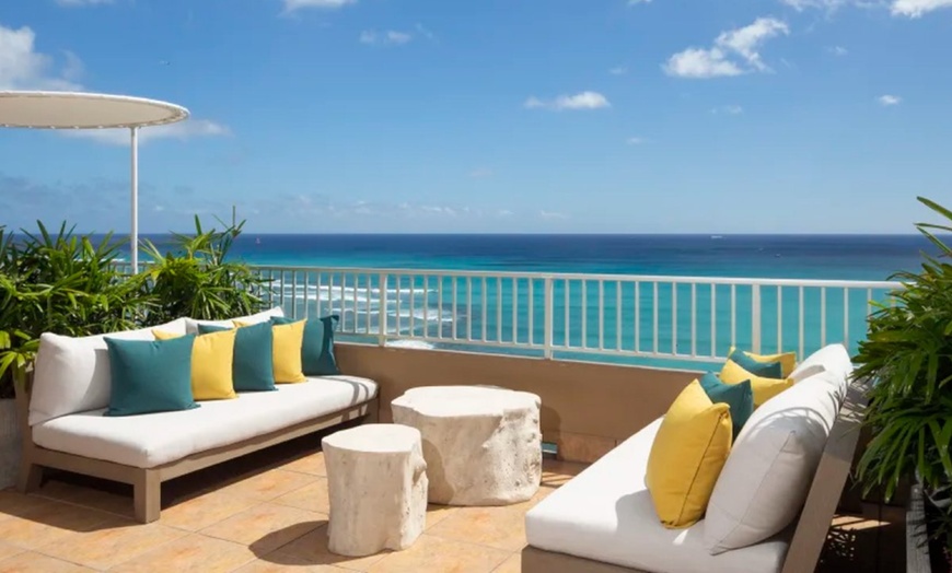 Image 1: Steps from Waikiki Beach and Free Surf-Board Credits Each Day