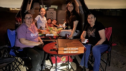 Get one Free Pizza, a box of popcorn and two Free Drinks with the purchase of any Family Night Movie: Saturdays Only - Sunset Drive-In Cinema Laredo, Texas