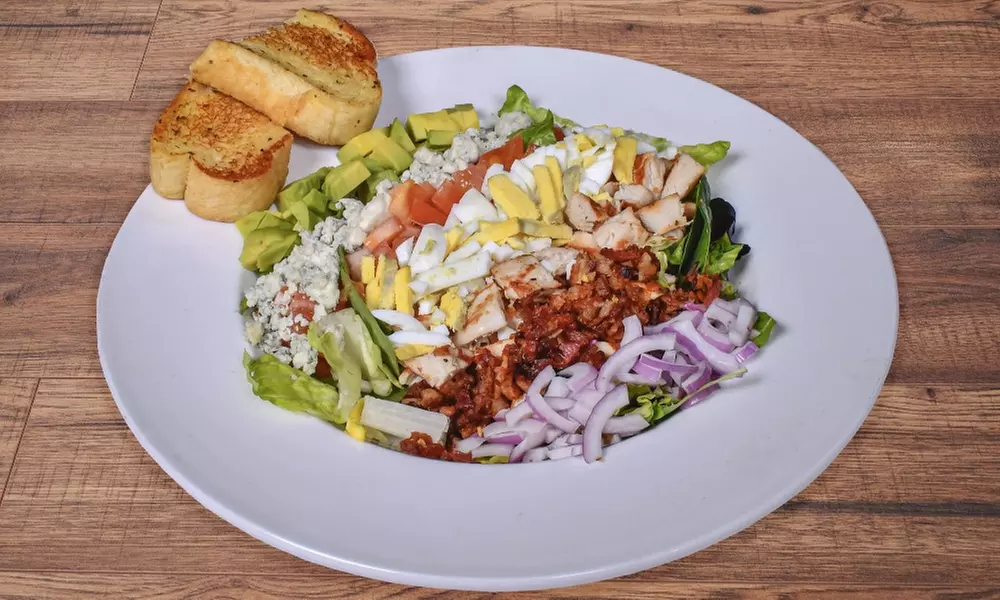 Food and Drink Credit Worth $40 or $80 at a Lively Poker Venue 