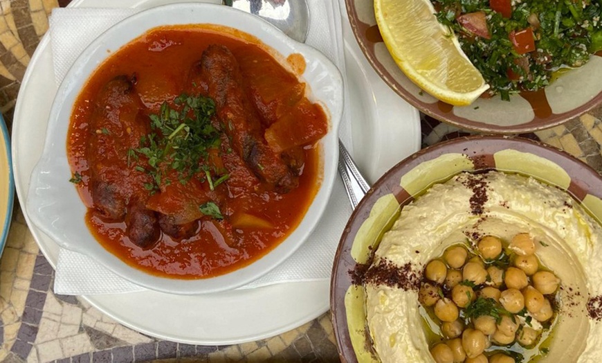 Image 1: Choose any Main Course & Glass of Wine or Any Mezza For Up to Four 
