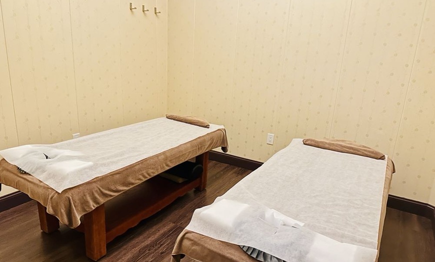 Image 1: Custom 60-Minute Full Body or Couples VIP Room Massage at Spa Zone