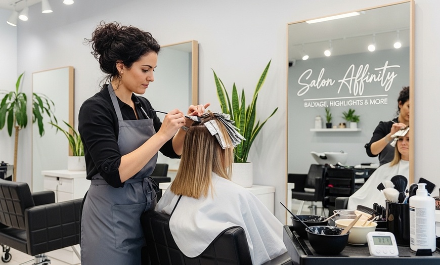 Image 1: Elevate Your Look with Woman's Haircut, Blow Dry, Highlights, & More  