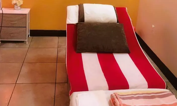 60 or 90-Min Deep Tissue Massage, Hot Stones, Aromatherapy & Foot Rub