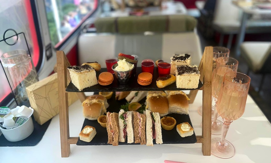 Image 3: Glasgow or Edinburgh Red Bus Bistro Tour w/ Afternoon Tea - 2, 3, or 4