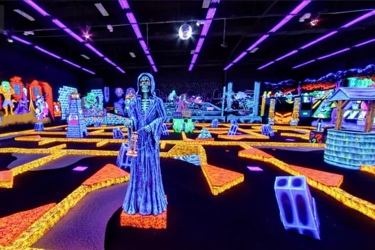 Enjoy 18 Holes of Blacklight Mini Golf, Up to 31% Off
