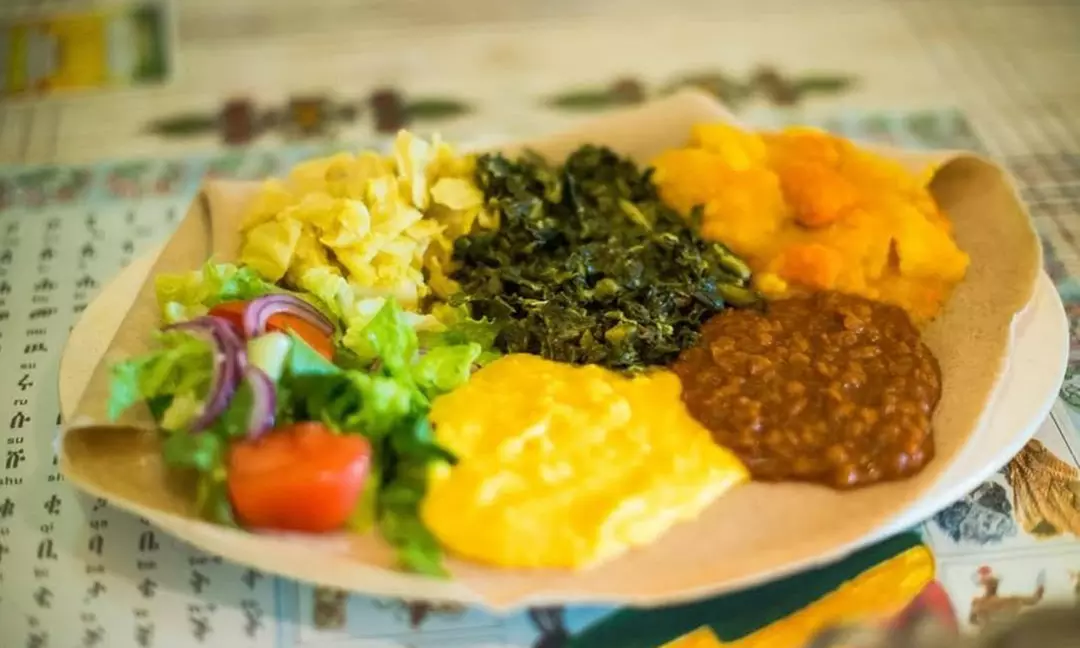 Experience Queen Sheba of Sacramento's Ethiopian dishes with Veggie or Vegan Combo Platter and $25 Gift Card, up to 20% off - Primary Image