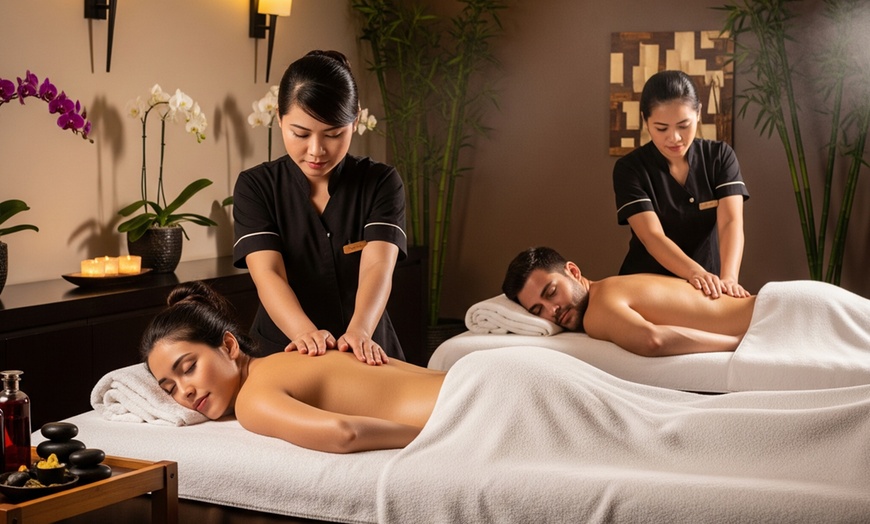 Image 1: 60 or 90-Min Couples Massage + Hot Stones with or without 25-Min Sauna