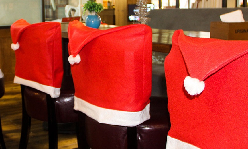 Image 2: Christmas Santa Claus Hat Design Dining Chair Slipcovers Chair Back Covers