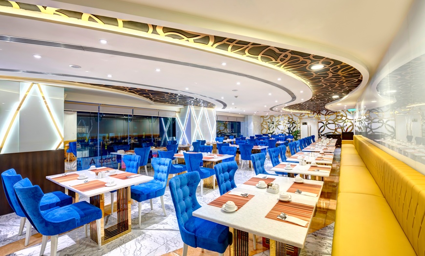 Image 1: Experience a Delicious Dinner Buffet with Drinks at an Iconic Venue