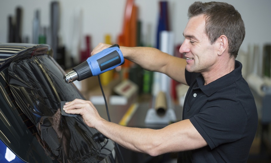 Image 1: Up to 48% Off on Automotive Window Tinting at Urbano Window Tinting Service