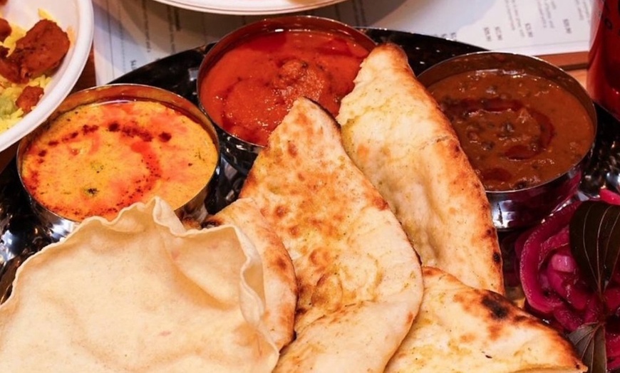 Image 5: Get $50–$150 Toward Food & Drinks at Me & Yogi Indian Kitchen
