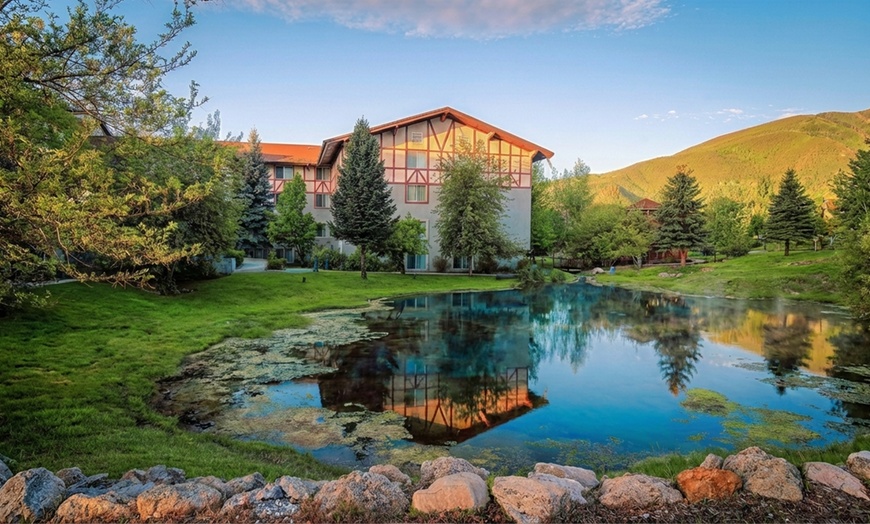 Image 11: Cozy alpine rooms, heated pool, and mountain views