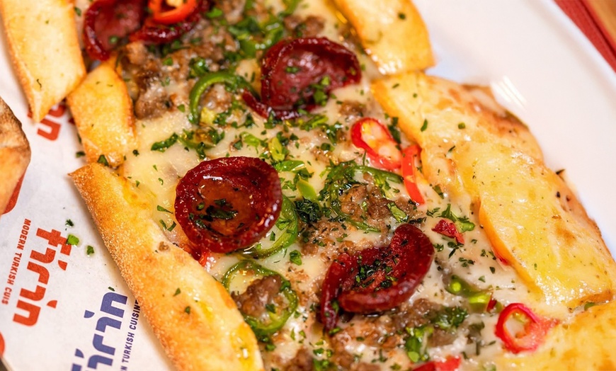 Image 3: Savor Authentic Turkish Pide with a Refreshing Drink