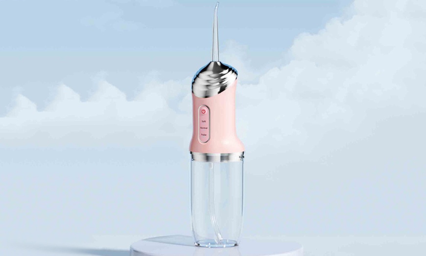 Image 8: Three Modes Electric Cordless Water Flosser for Teeth
