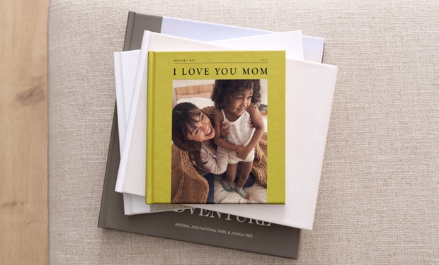 Custom Shutterfly photo book with open pages showing family photos.