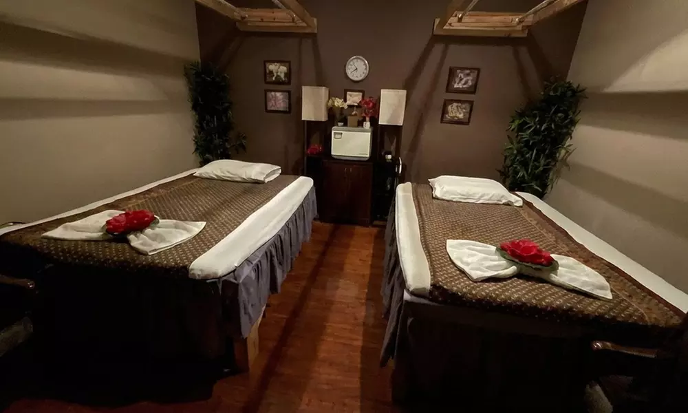 60 or 90-Min Solo or Couples Deep Tissue, Thai, or Swedish Massage
